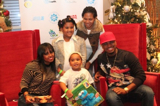 R&B singer/songwriter Ne-Yo takes a picture with attendees of The Giving Back Tour. Actress Keisha Knight-Pulliam is pictured on the left. (Photo Credit: DJ Blak Magic)