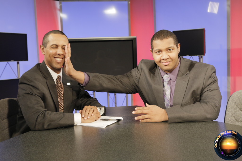 Author Lenny McAllister clowns around with his son Peace on the set of his show on the Pittsburgh Cable News Channel. (Photo Credit: Lenny McAllister)