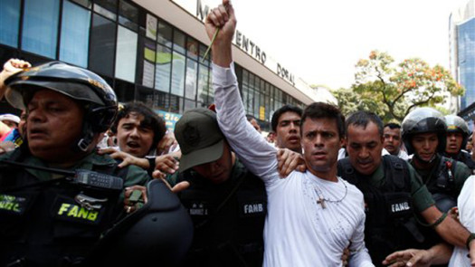 Venezuelan opposition leader Leopoldo Lopez has turned himself into police to face charges of murder, terrorism and arson.  (Photo Credit: Google Images)