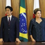 Japan's Prime Minister Shinzo Abe stands next to Brazil's President Dilma Rousseff during a meeting in Brasilia