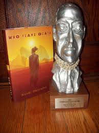 Nnedi Okorafor's World Fantasy Award next to her book "Who Fears Death." (Photo Credit: Google Images.)